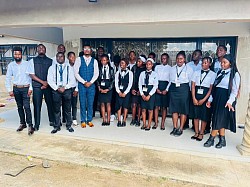 Dr Hibeenzu Bornwell Pausing with Hands On Technical college Students in Zimbabwe January 2026